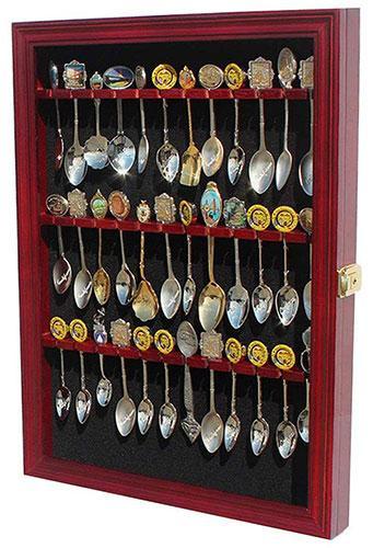 Handcrafted wooden spoon display cabinet with glass door and black felt background, showcasing multiple rows for spoon collection.