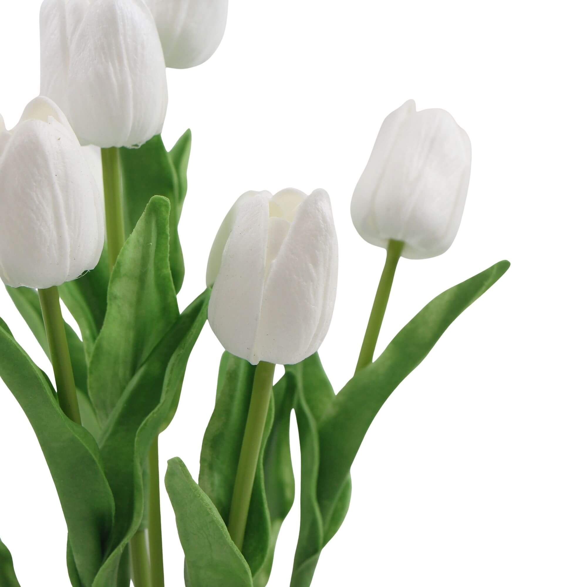 A beautiful arrangement of white artificial tulips in a modern ceramic bowl, showcasing vibrant blooms and lush green foliage.