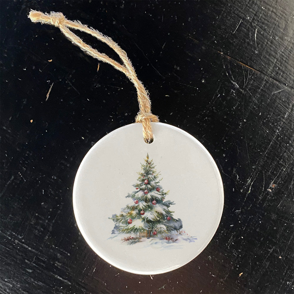 A beautifully crafted porcelain ornament featuring a Forest Christmas Tree design, perfect for holiday decor or gifting.
