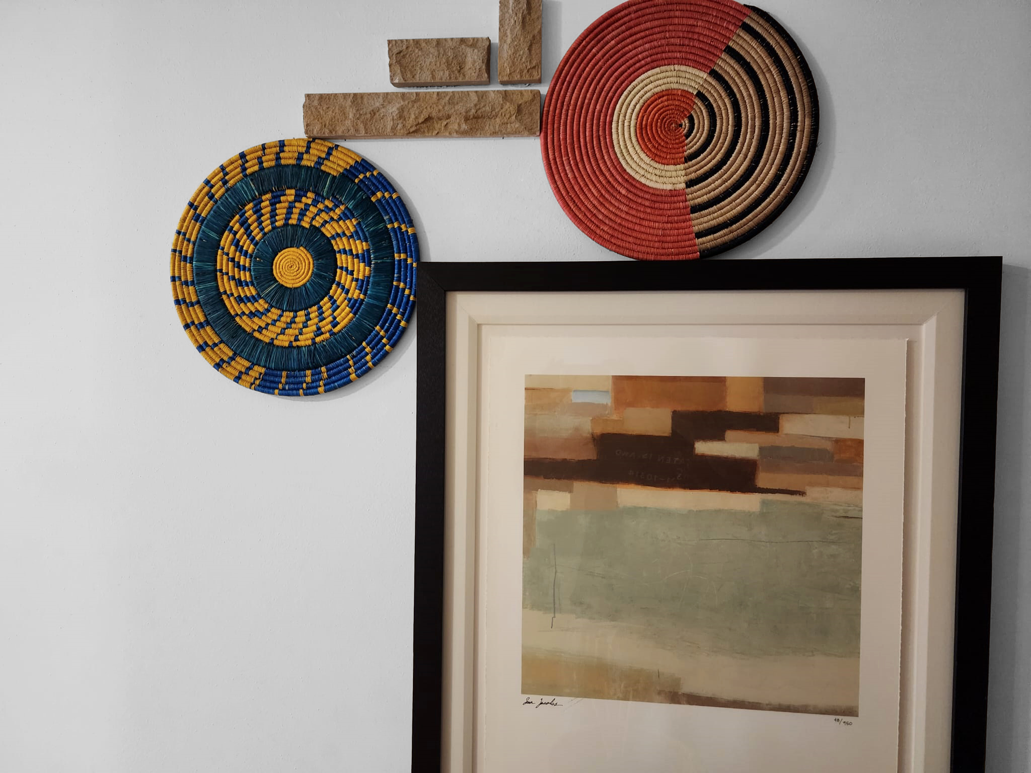 Forodhani Handcrafted Wall Disc/Placemat showcasing authentic African weaving design with vibrant colors and natural fibers.