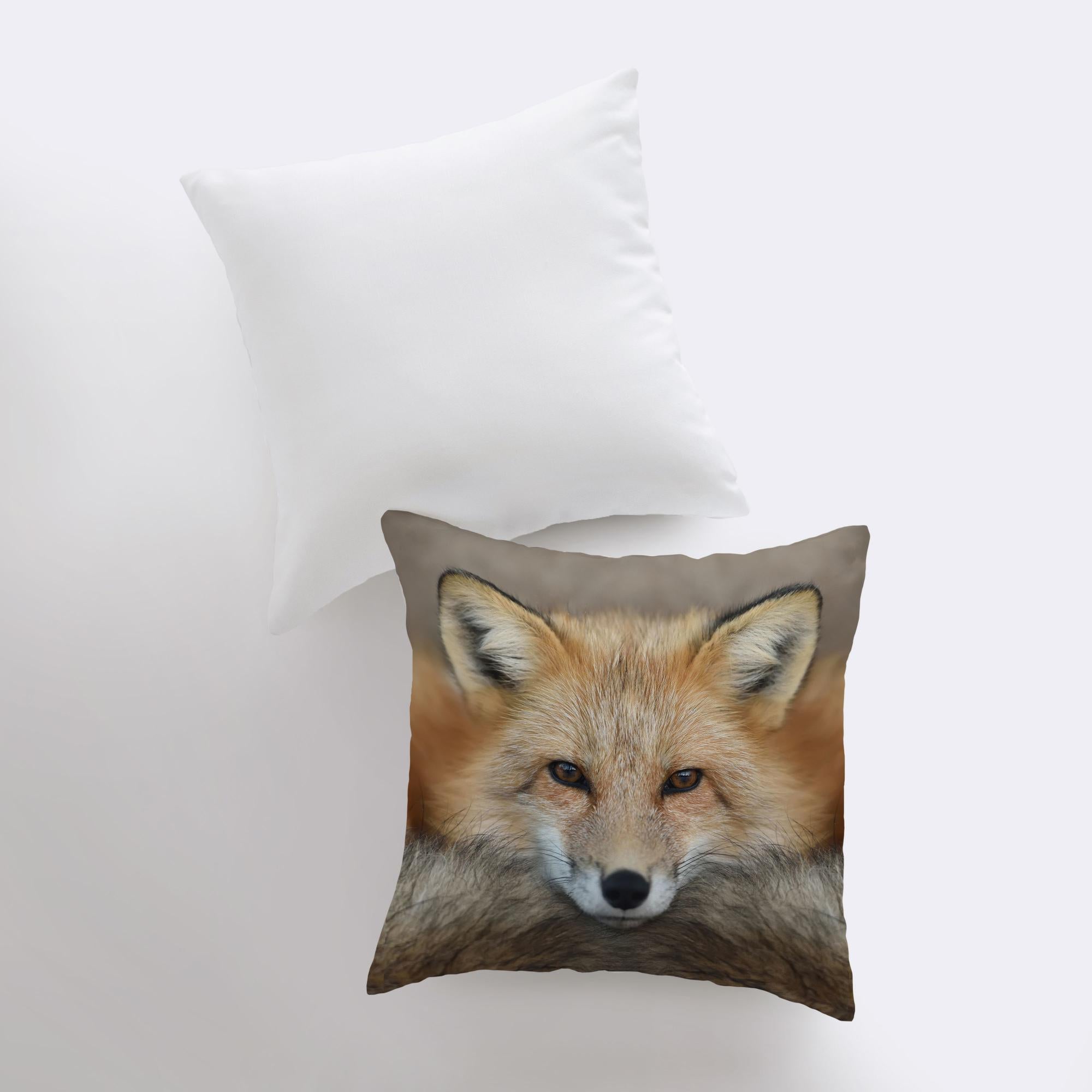 A beautifully crafted pillow cover featuring a close-up photograph of a curious fox, set against a light beige background with a concealed zipper.