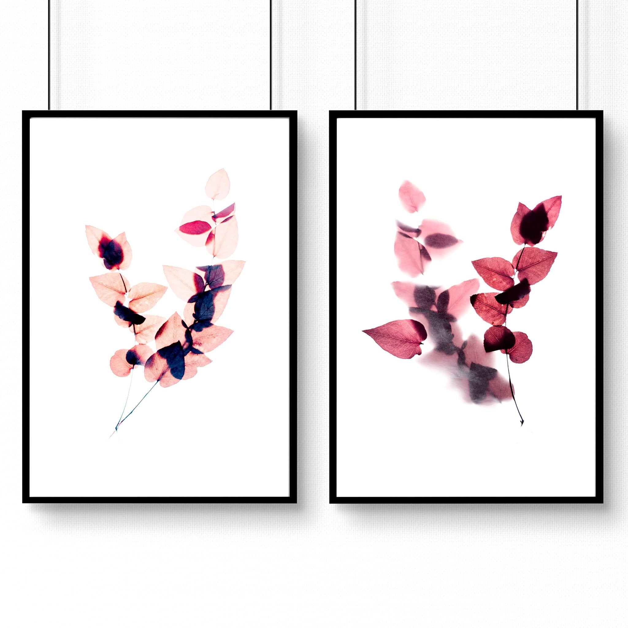 Set of 2 framed Autumnal Botanical wall art prints in rich Burgundy tones, showcasing intricate leaves and blooms for a cozy bedroom atmosphere.