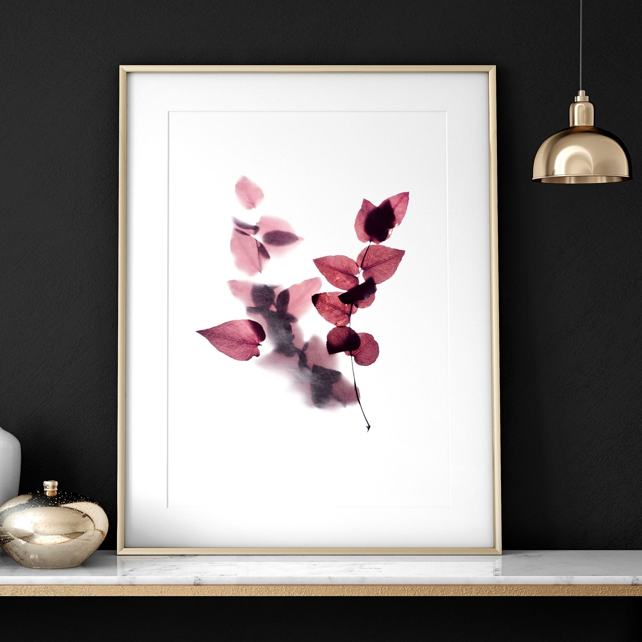 Set of 2 framed Autumnal Botanical wall art prints in rich Burgundy tones, showcasing intricate leaves and blooms for a cozy bedroom atmosphere.