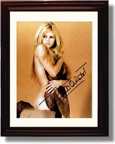 Framed glossy print of Brigitte Bardot with a printed autograph, showcasing her iconic style.