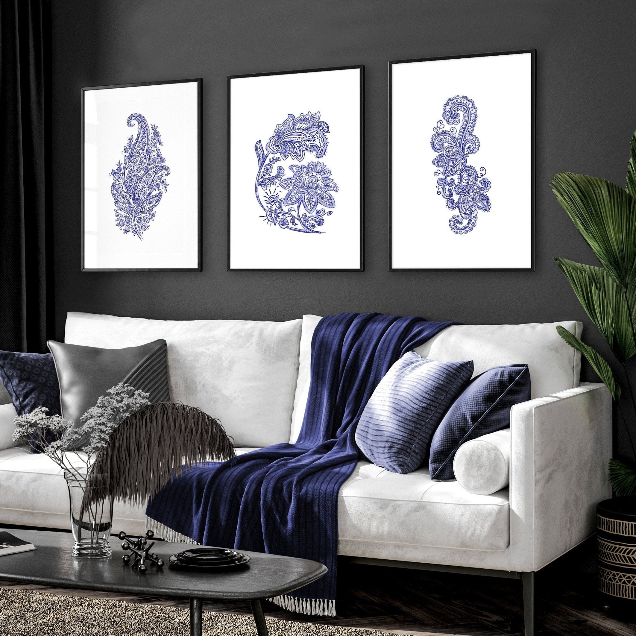 Set of 3 framed wall art prints featuring hand-drawn paisley motifs in indigo blue, perfect for bohemian living room decor.