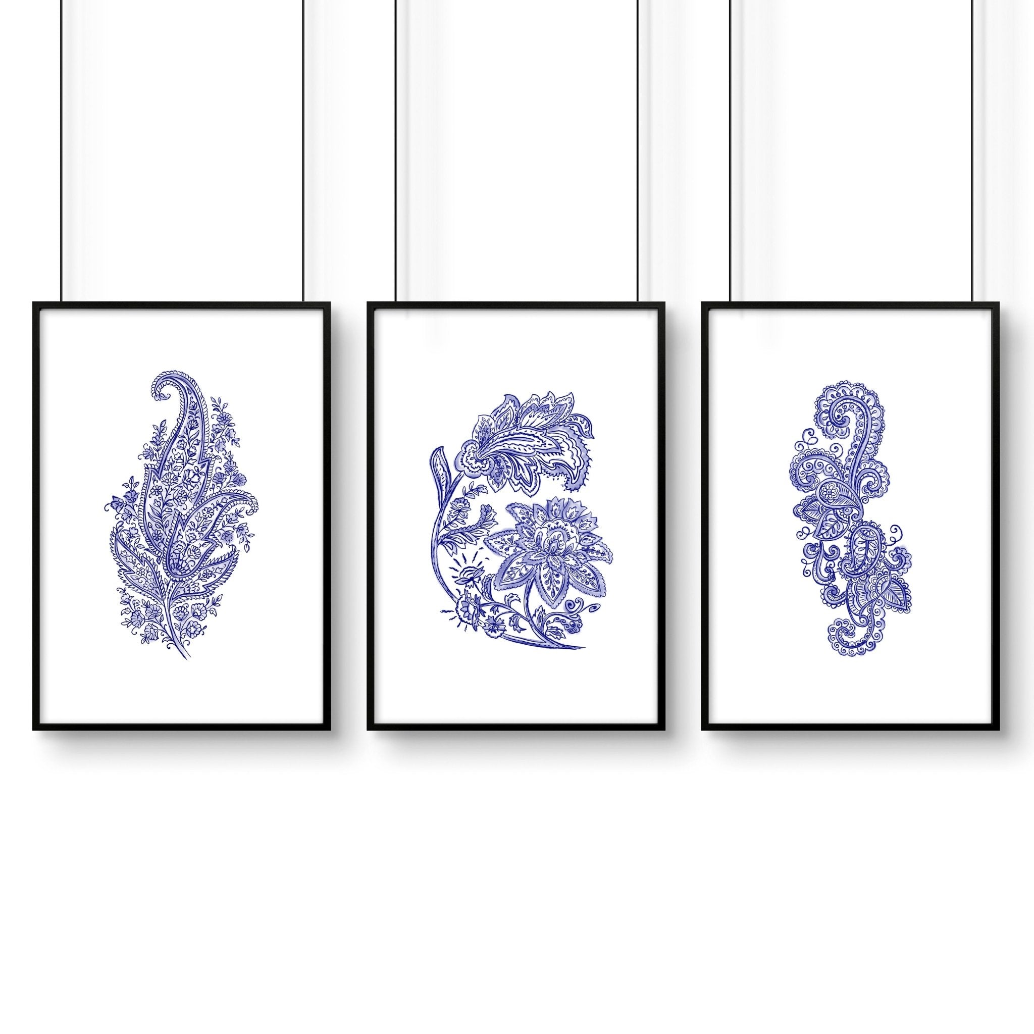 Set of 3 framed wall art prints featuring hand-drawn paisley motifs in indigo blue, perfect for bohemian living room decor.
