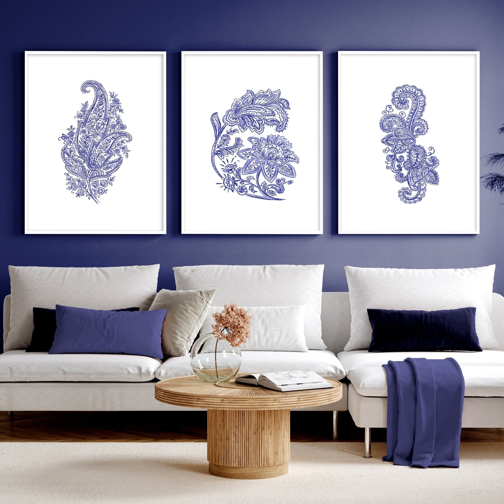 Set of 3 framed wall art prints featuring hand-drawn paisley motifs in indigo blue, perfect for bohemian living room decor.