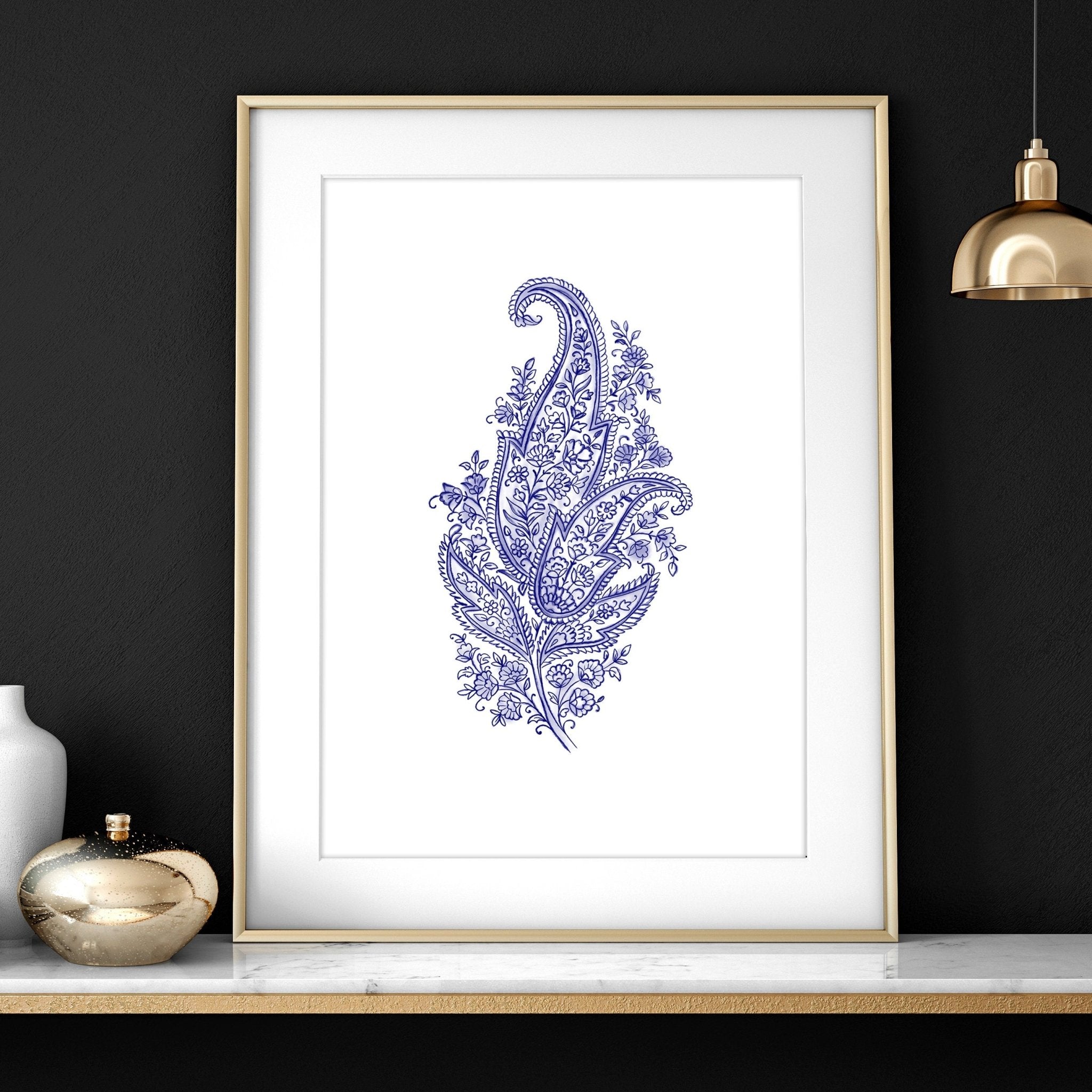 Set of 3 framed wall art prints featuring hand-drawn paisley motifs in indigo blue, perfect for bohemian living room decor.