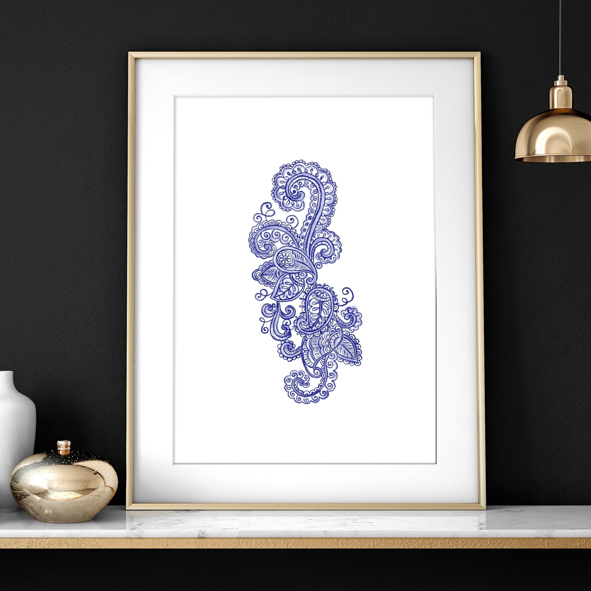 Set of 3 framed wall art prints featuring hand-drawn paisley motifs in indigo blue, perfect for bohemian living room decor.