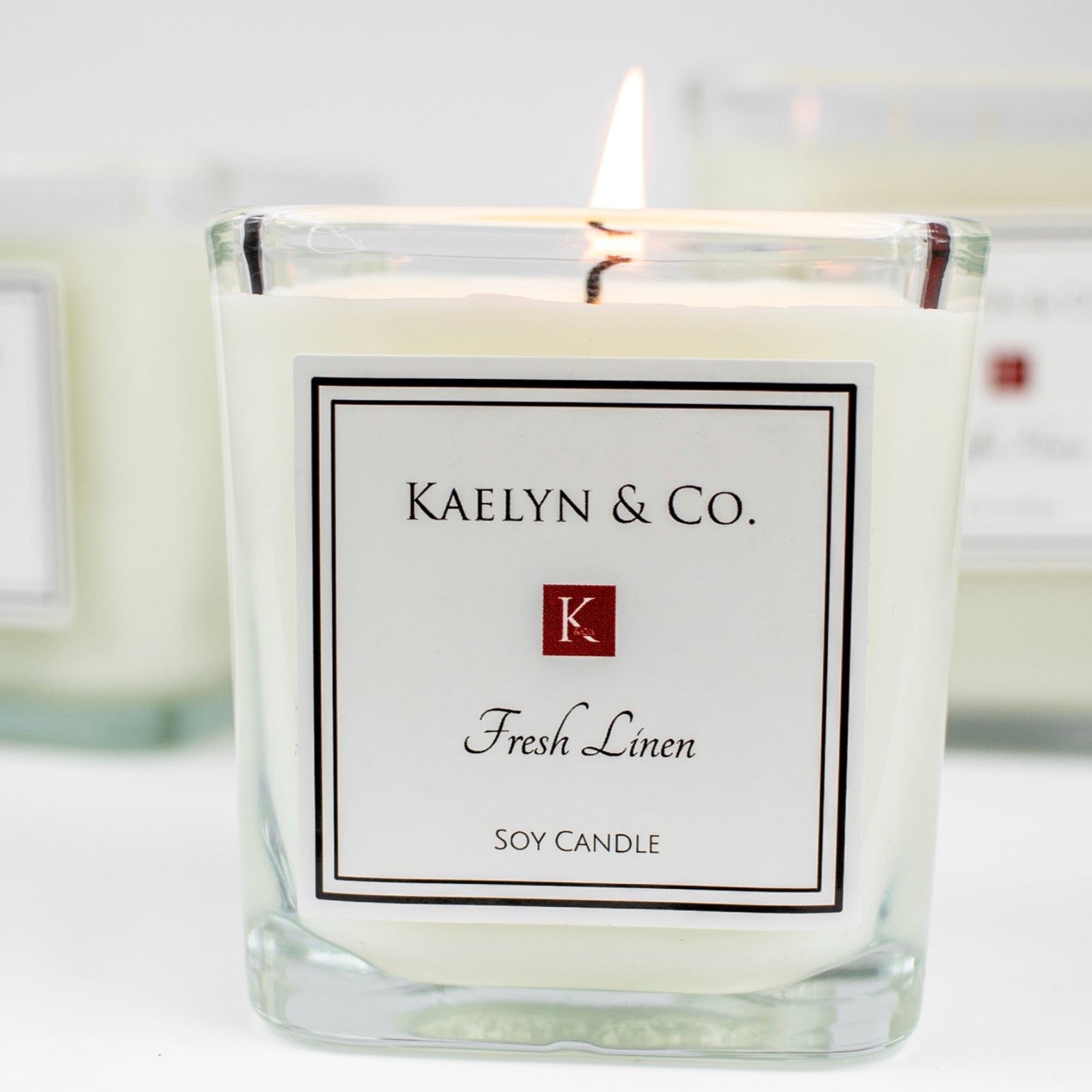 Fresh Linen Small Cube Candle in a decorative box, showcasing its elegant design and clean fragrance.