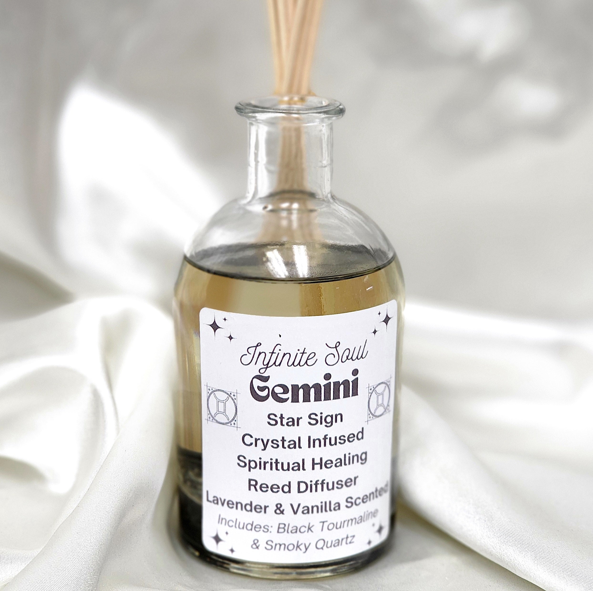 Gemini Star Sign Crystal Infused Reed Diffuser featuring Lavender and Vanilla scent with Black Tourmaline and Smoky Quartz crystals.