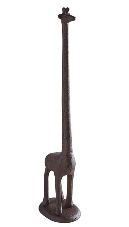 A whimsical giraffe-shaped paper towel holder made of durable cast iron, standing 19 inches tall with a brown finish.