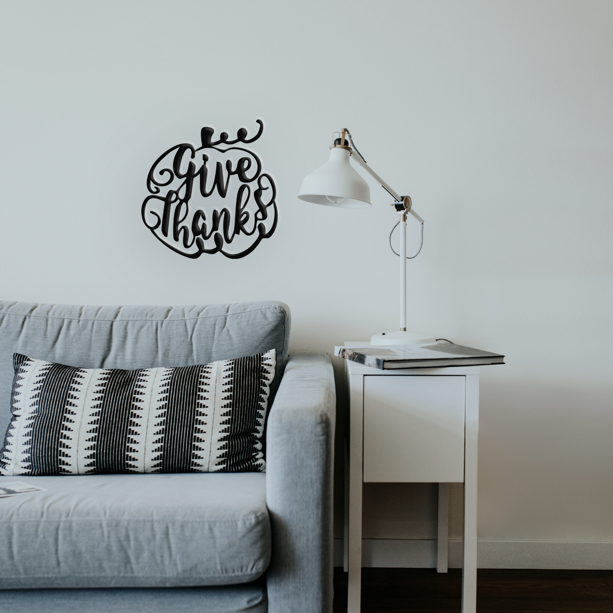 Give Thanks Pumpkin Metal Wall Art featuring a pumpkin design, crafted from high-quality steel with a low gloss finish, perfect for Halloween decor.