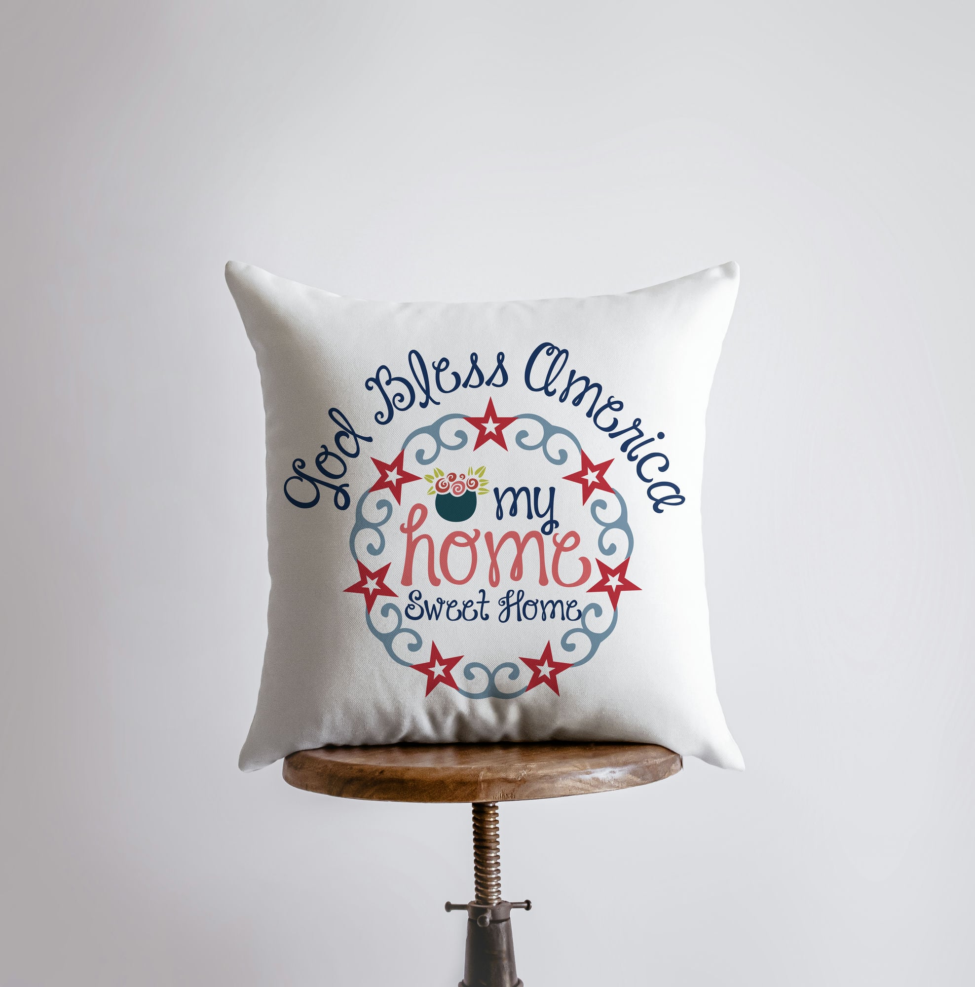 God Bless America pillow cover featuring a patriotic design with vintage red stars on the reverse side, perfect for home decor.
