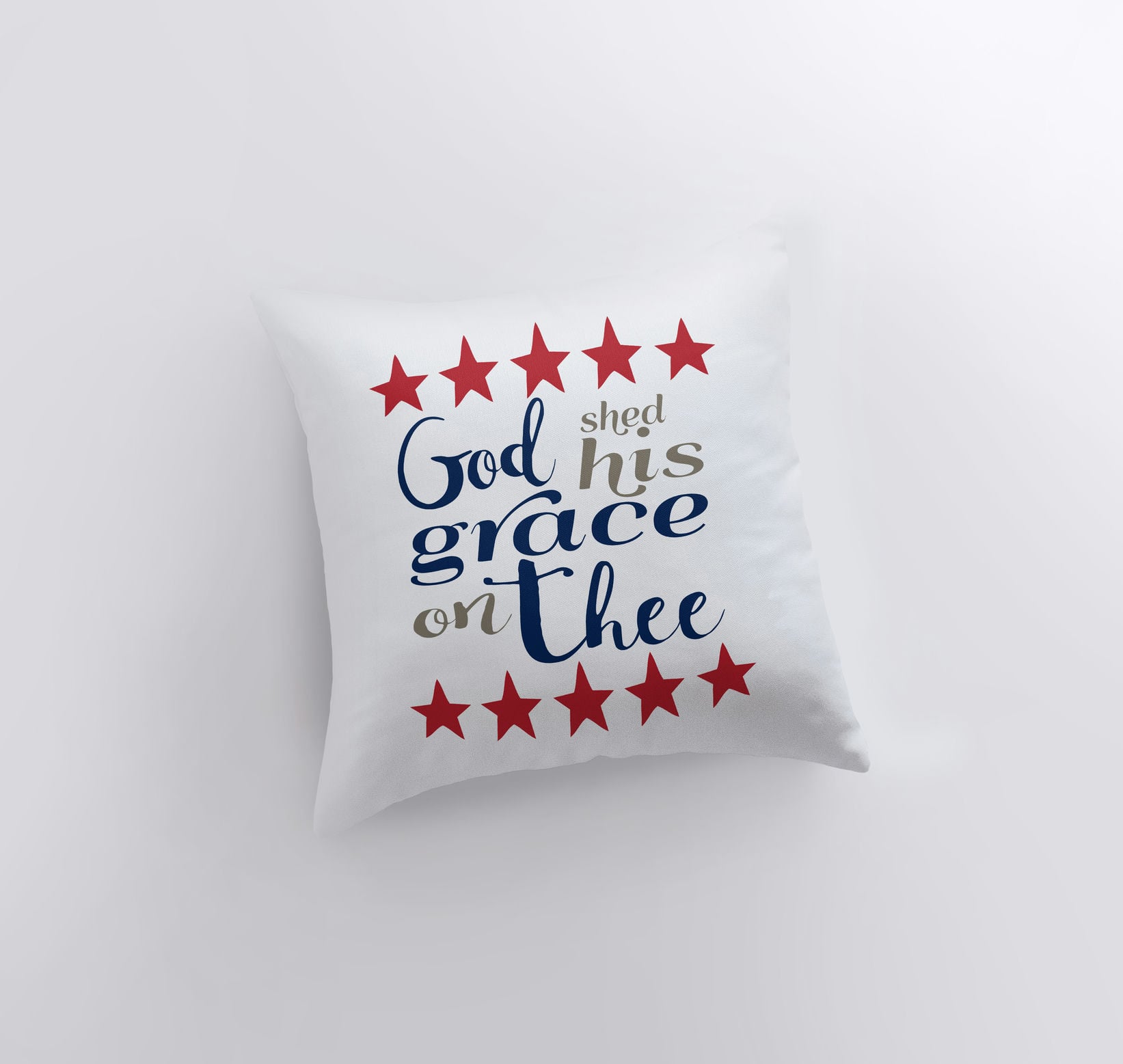 Handmade throw pillow featuring 'God Shed His Grace on Thee' design with red stars on the back, perfect for patriotic home decor.