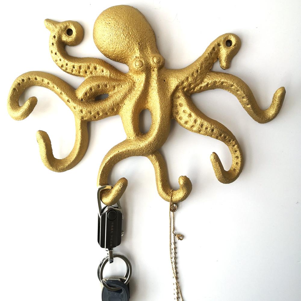 Gold Cast Iron Octopus Wall Hook, intricately designed with a nautical theme, perfect for hanging keys and leashes.