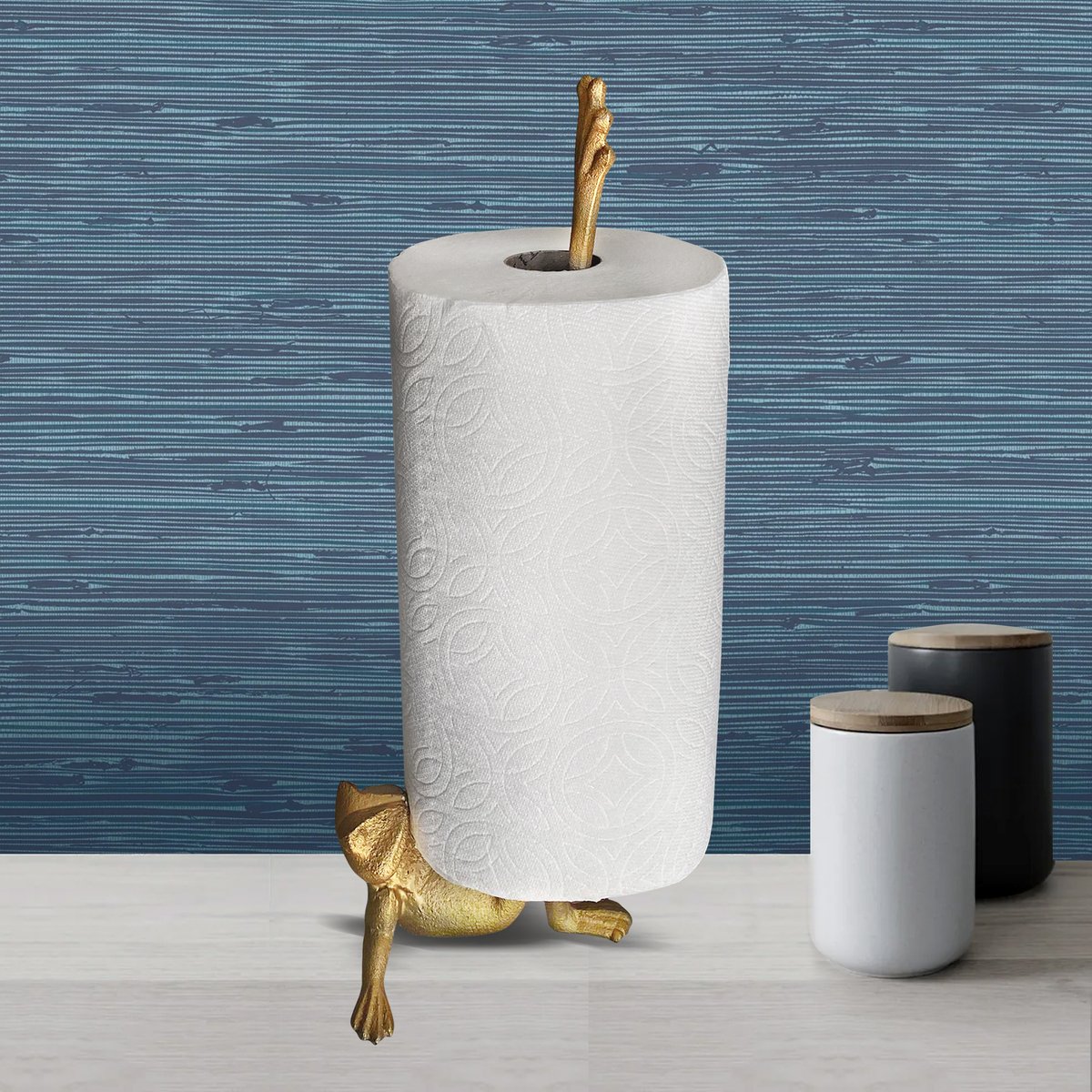 Gold Frog Paper Towel Holder made of cast iron, featuring a whimsical frog design with a hand brushed gold finish.