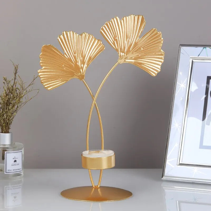 A luxurious Golden Ginkgo Leaf Candle Holder with a stunning gold finish, designed to resemble ginkgo leaves, perfect for elegant home decor.