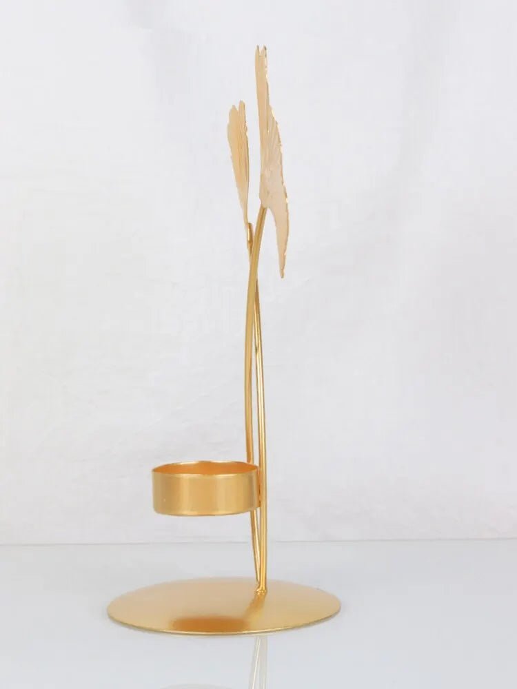 A luxurious Golden Ginkgo Leaf Candle Holder with a stunning gold finish, designed to resemble ginkgo leaves, perfect for elegant home decor.
