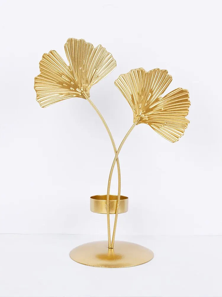 A luxurious Golden Ginkgo Leaf Candle Holder with a stunning gold finish, designed to resemble ginkgo leaves, perfect for elegant home decor.