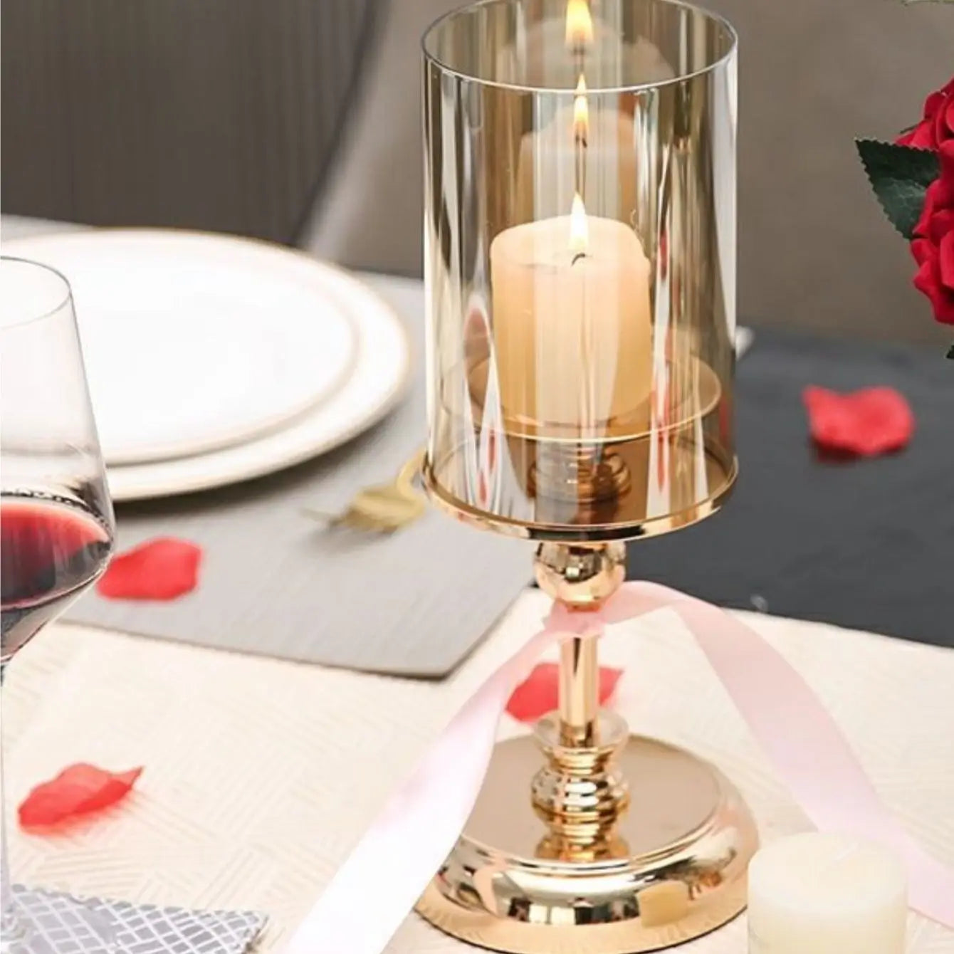 Elegant golden glass candle holders designed for pillar candles, showcasing a luxurious finish and reflective surface.