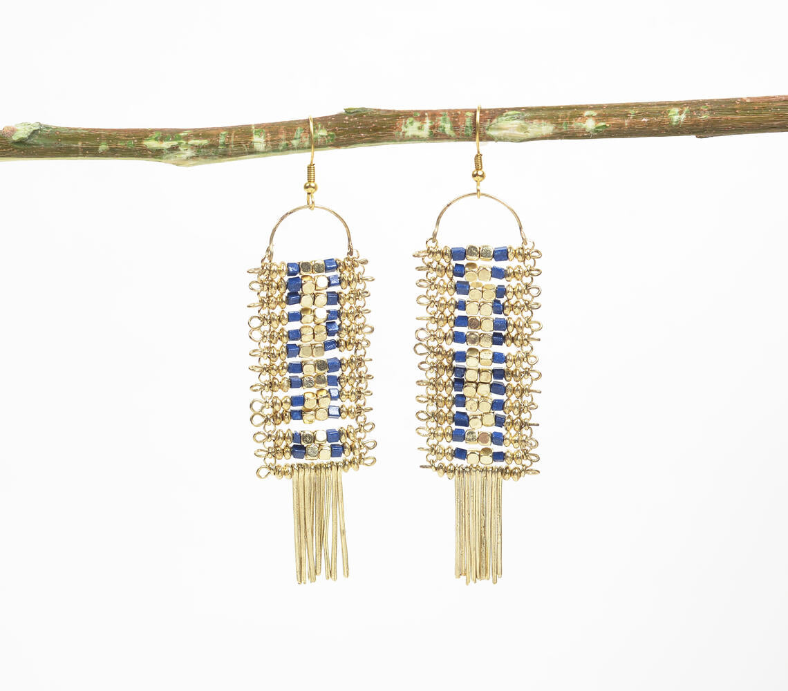 Gold-toned shoulder-duster earrings adorned with blue beads, showcasing intricate handmade craftsmanship.
