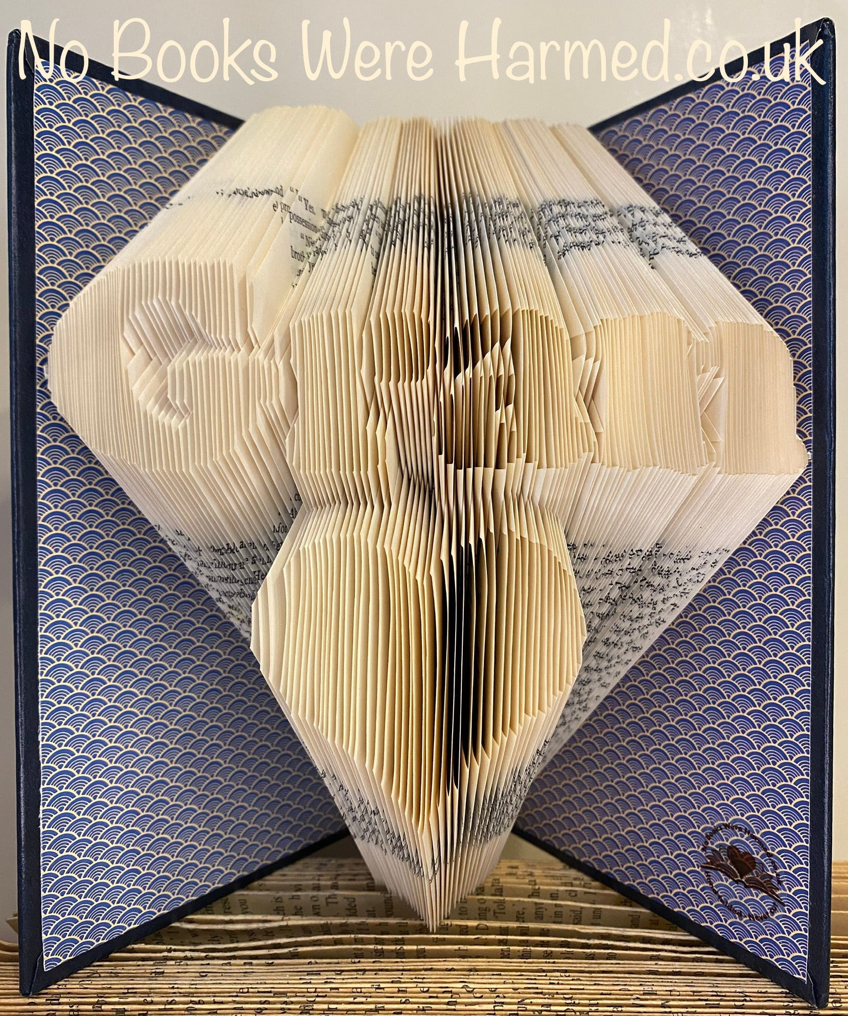 Handcrafted art piece featuring 'Gran' over a love heart, made from vintage book pages.
