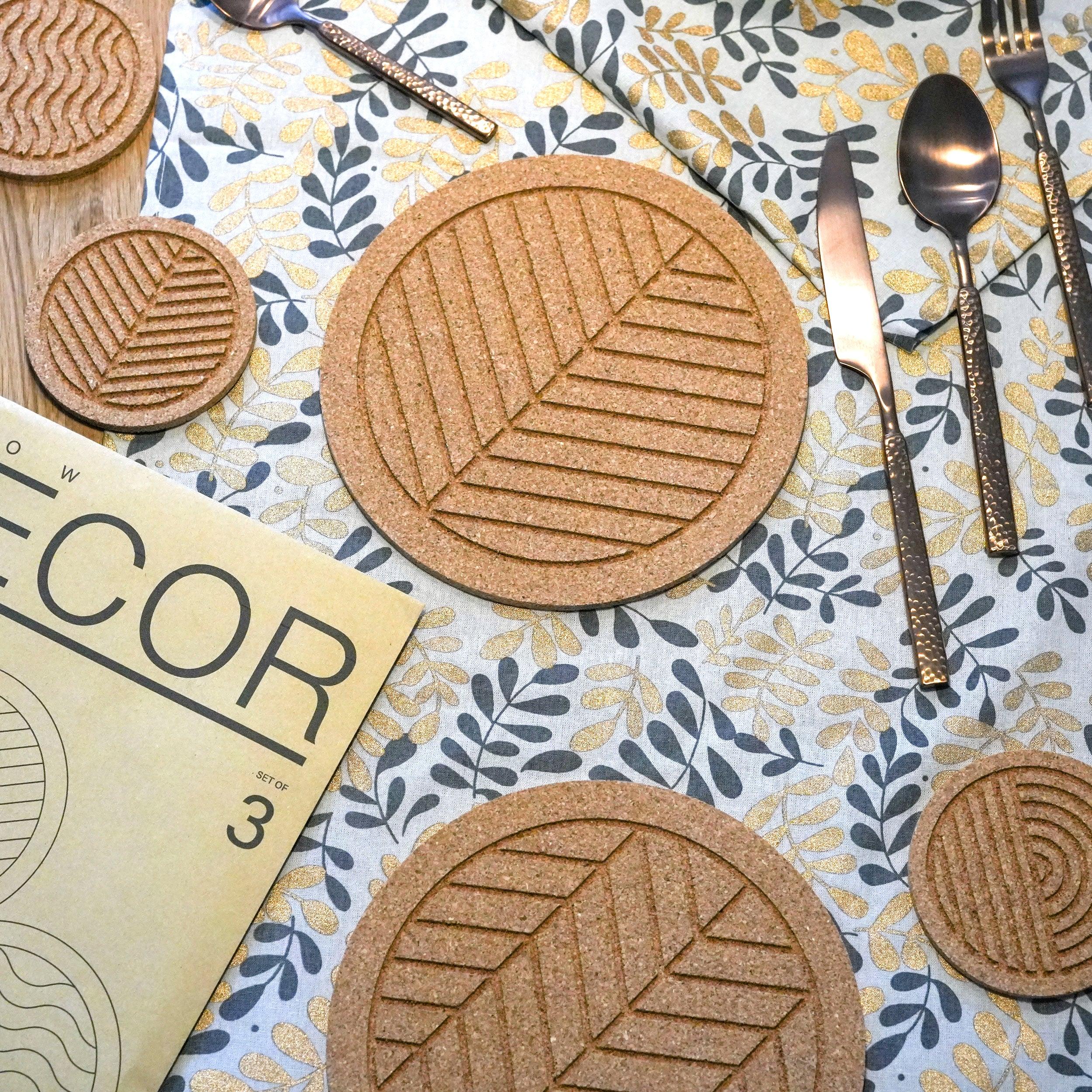 Great Flow cork trivet set of 3 pieces, featuring nature-inspired designs like waves and leaves, perfect for protecting surfaces.