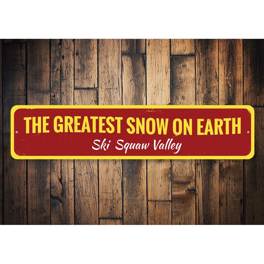 Greatest Snow On Earth Sign made of high-quality aluminum, featuring customizable text and pre-drilled holes for easy mounting.