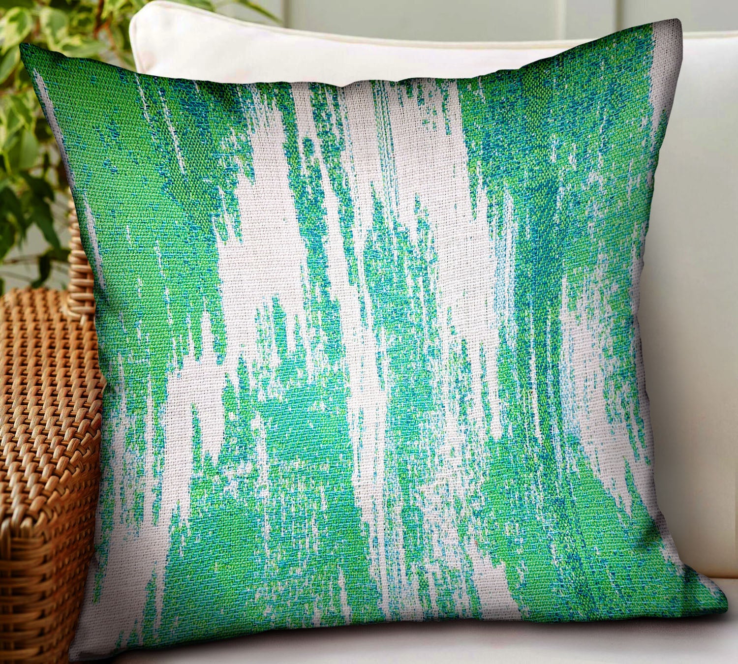 Green Avalanche Green Ikat Luxury Throw Pillow showcasing vibrant green Ikat pattern, durable Sunbrella fabric, and invisible zipper closure.