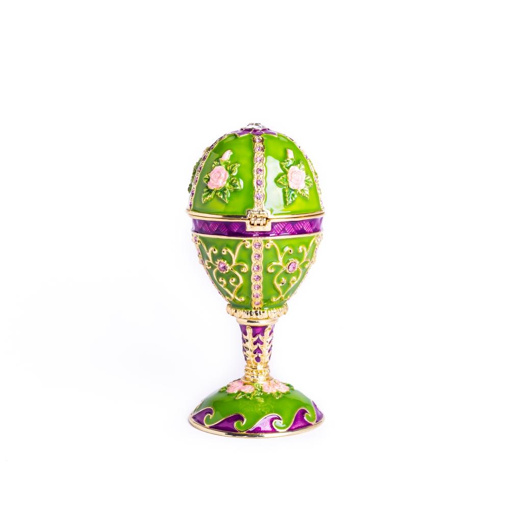 A stunning green Faberge egg trinket box adorned with flowers and Austrian crystals, featuring a 24K gold plating and a secure magnetic closure.