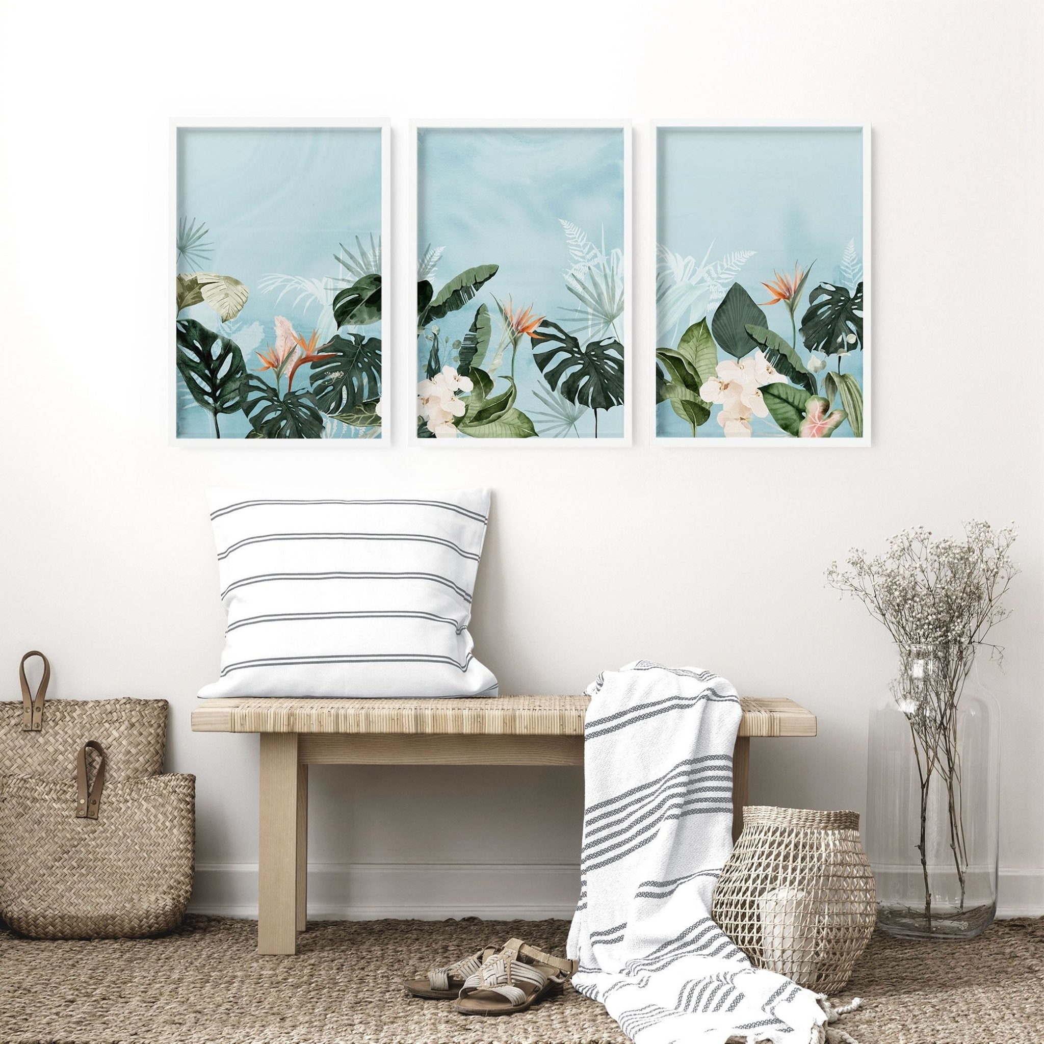 Set of 3 vibrant tropical wall art prints featuring lush greenery and serene beach scenes, perfect for enhancing living room decor.