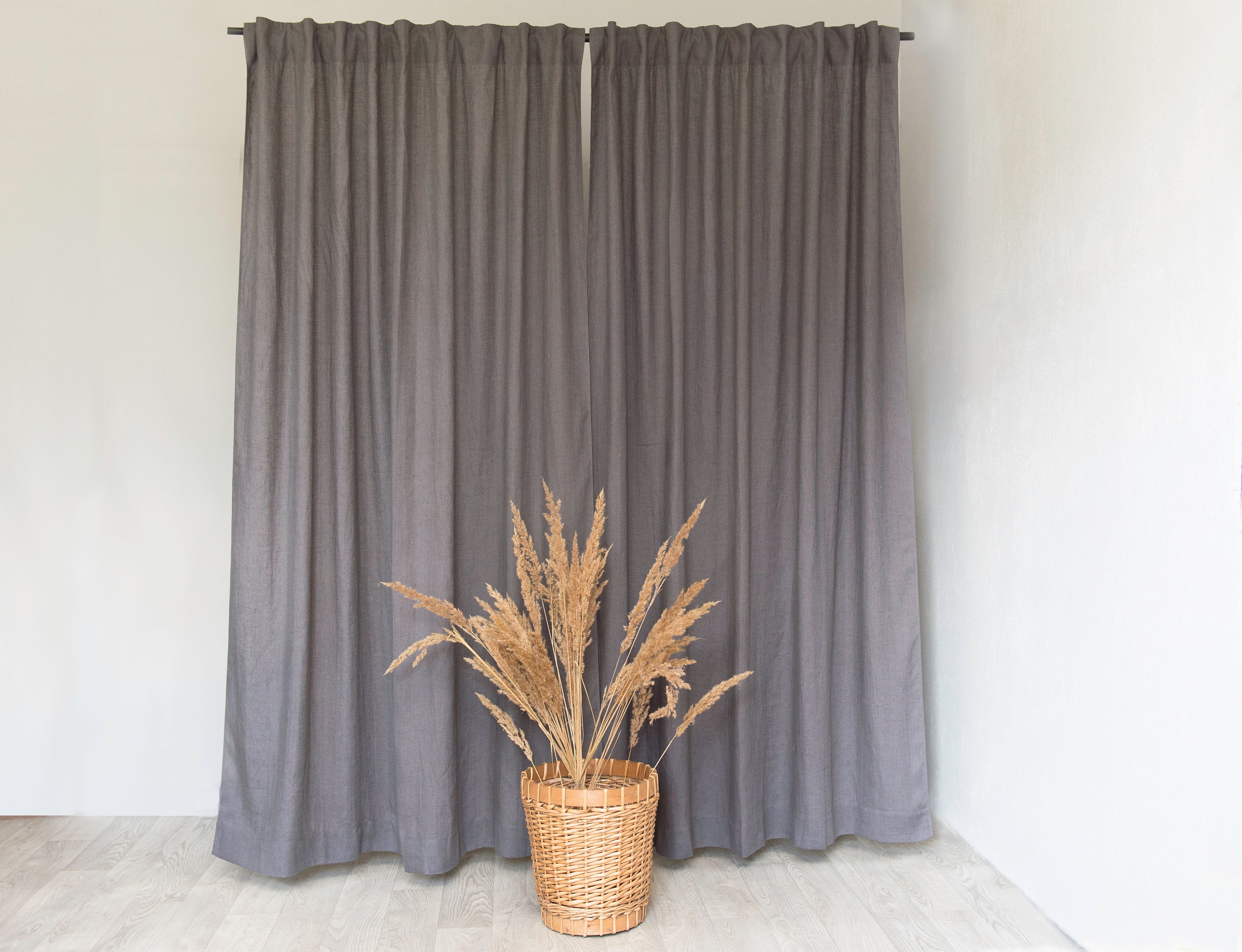 Grey linen curtain with multifunctional heading tape, showcasing its semi-sheer texture and elegant design.