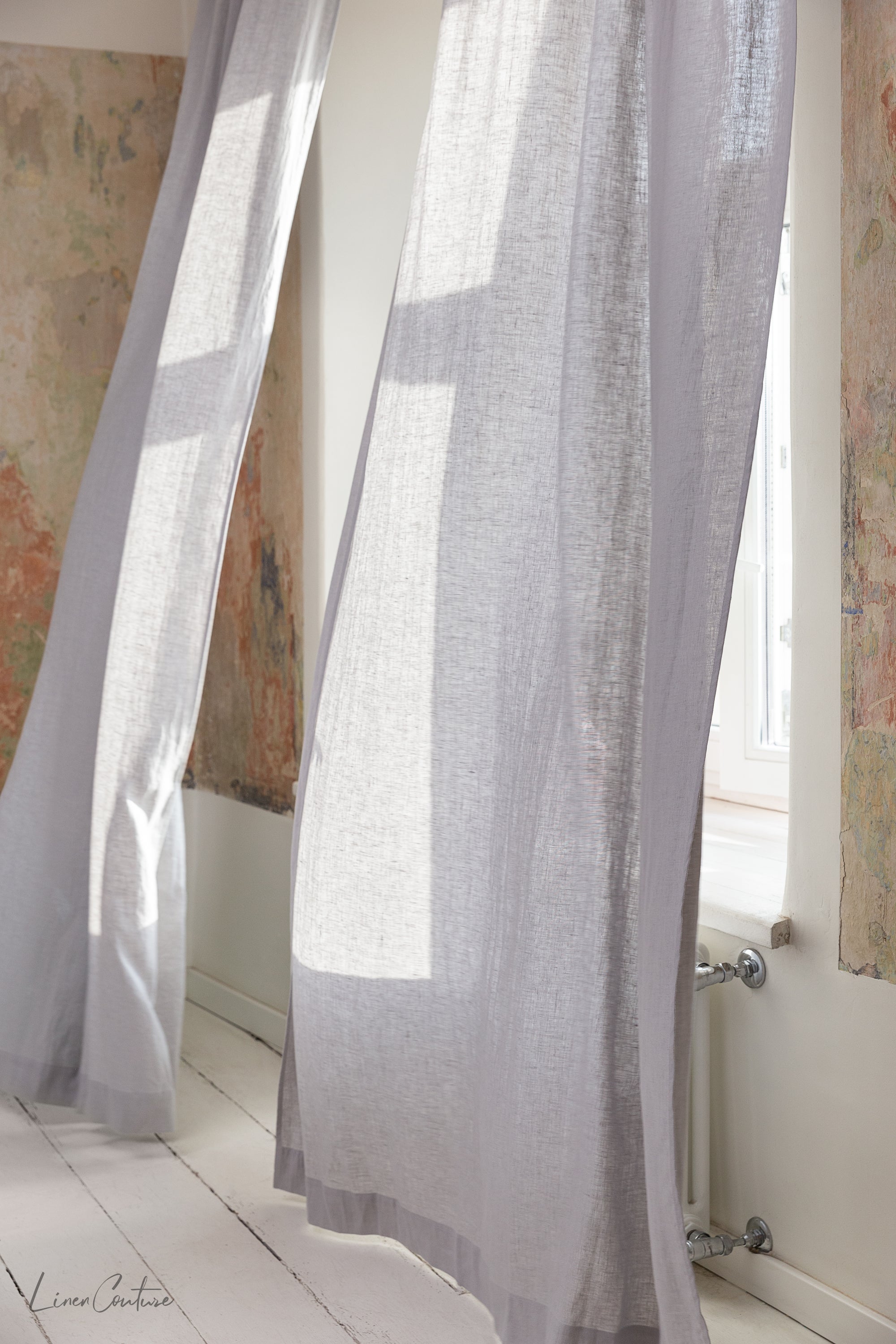 Grey linen curtain with multifunctional heading tape, showcasing its semi-sheer texture and elegant design.