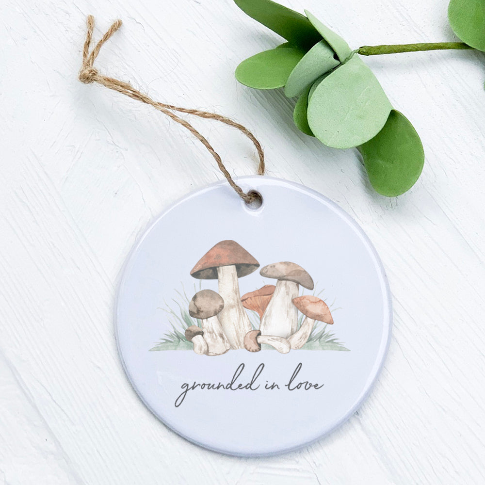 Grounded in Love Mushroom Ornament made of high-quality porcelain with a vibrant design, featuring whimsical mushrooms.