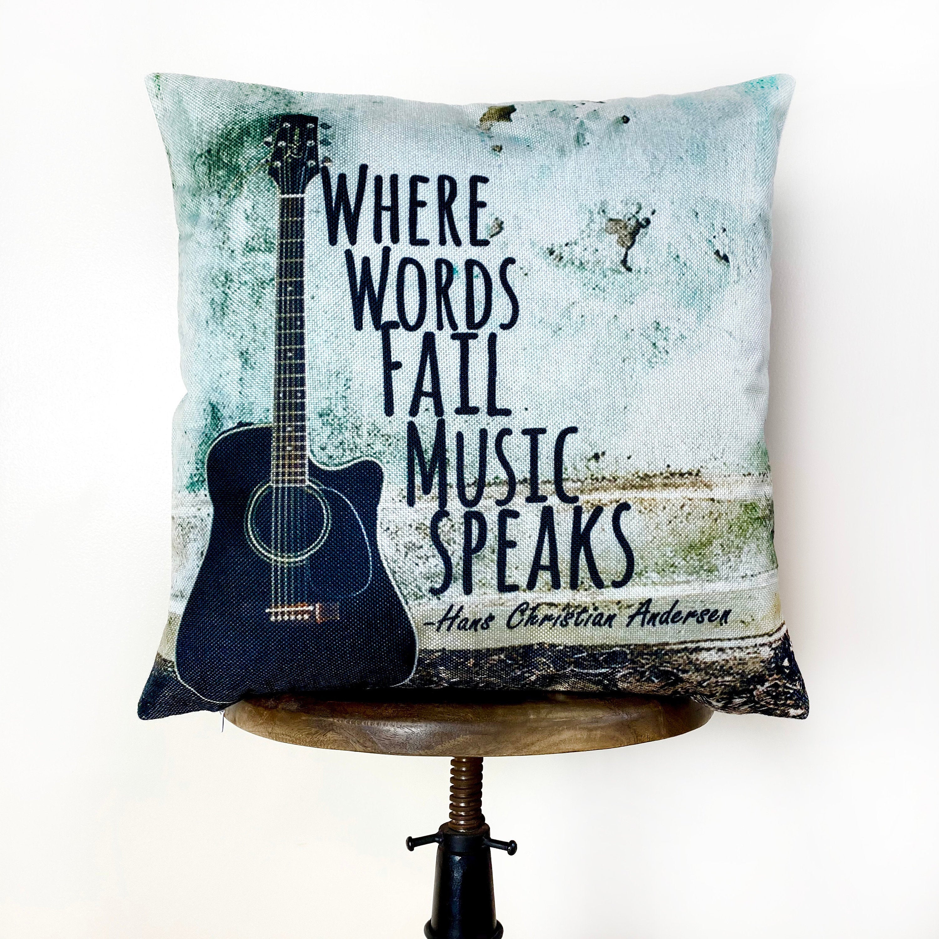 Handmade guitar pillow cover featuring a quote about music, perfect for home decor.