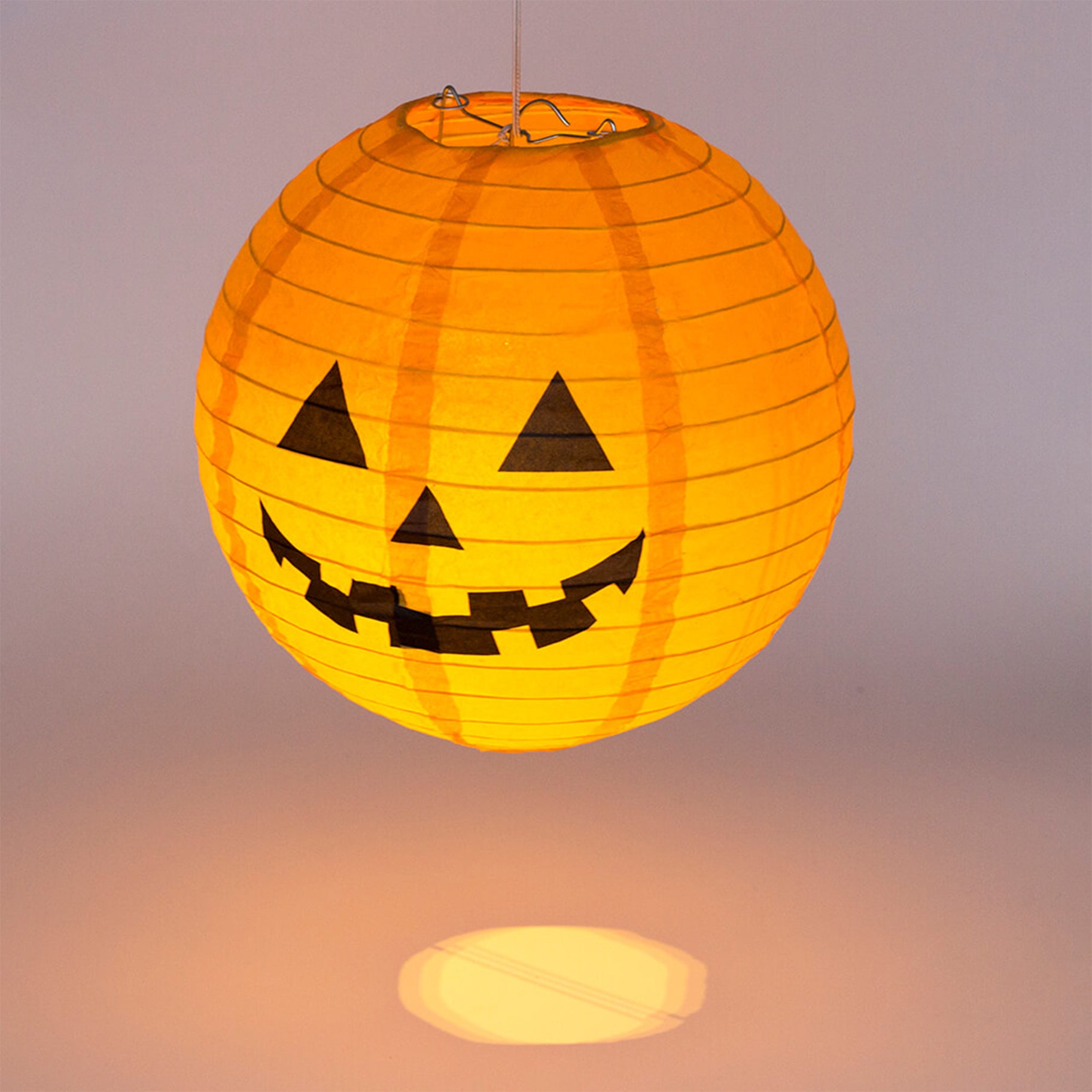 A set of 10 battery-operated Halloween Smiley Pumpkin Lantern Lights, featuring cheerful pumpkin faces and a warm white glow, perfect for festive decorations.