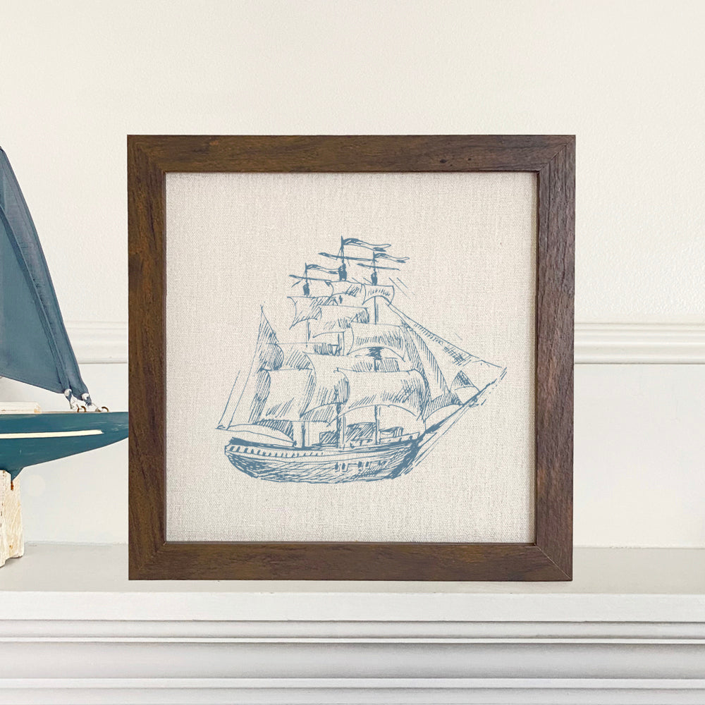 Hand Drawn Ship Framed Sign with a natural wood frame and linen-look background, featuring a detailed ship illustration.