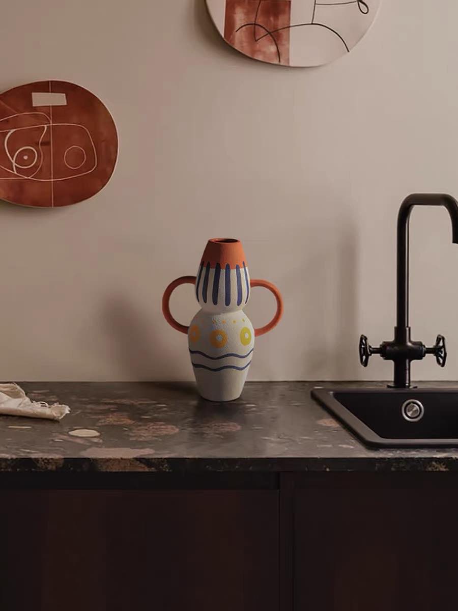 A colorful hand-painted abstract art ceramic vase featuring whimsical designs, perfect for flowers or as a decorative piece.