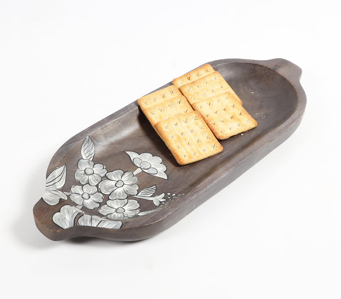 Hand painted elongated platter made of mango wood featuring intricate floral sketches, showcasing rustic elegance and artisanal craftsmanship.