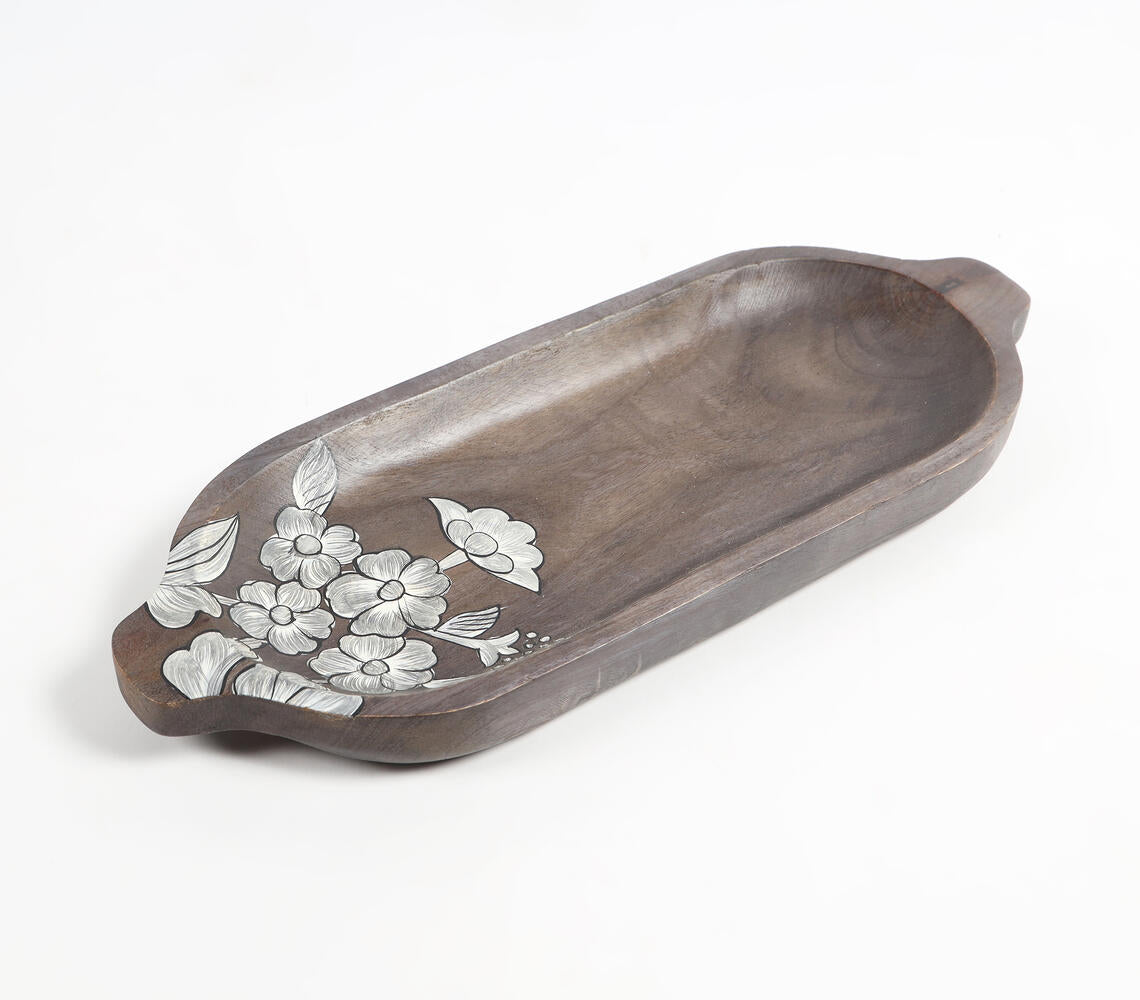 Hand painted elongated platter made of mango wood featuring intricate floral sketches, showcasing rustic elegance and artisanal craftsmanship.