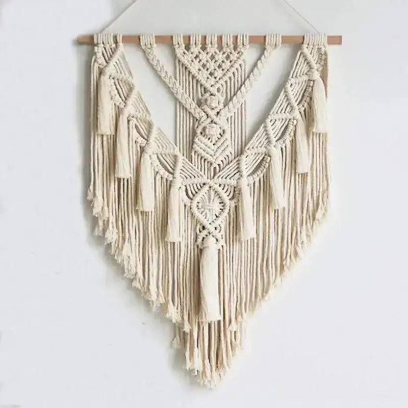 Hand Woven Macrame Wall Hanging in beige with intricate knots and tassels, perfect for bohemian home decor.