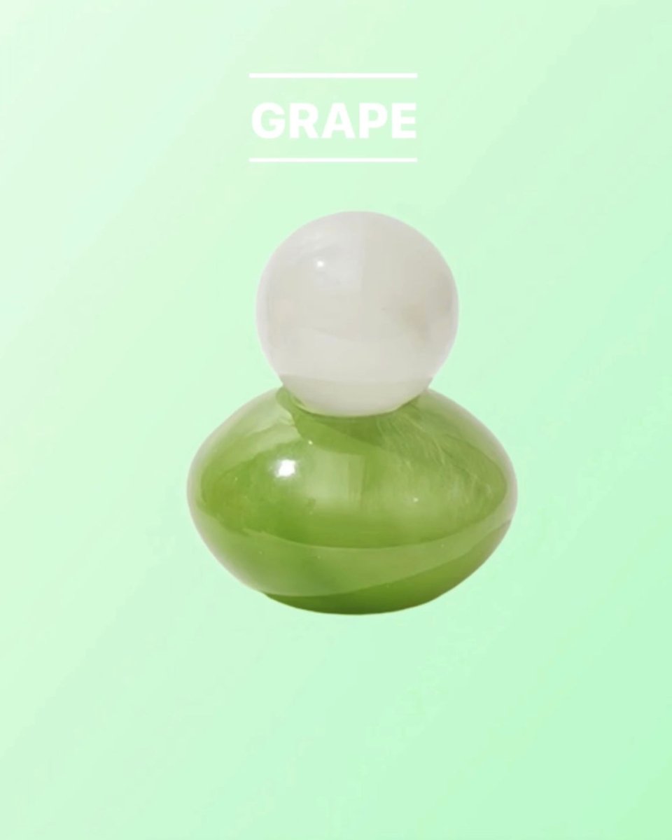 Handblown Bonbon Decorative Jar in vibrant dopamine colors, showcasing whimsical design and versatility for home decor.