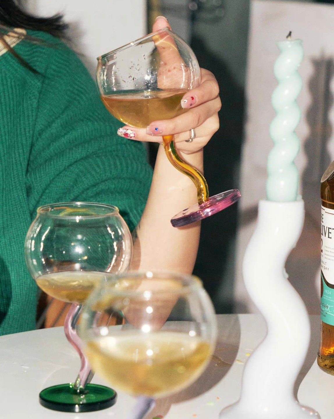 Handblown Bubble Wine Glass featuring a colorful, whimsical design with a wavy stem, perfect for enhancing wine tasting experiences.