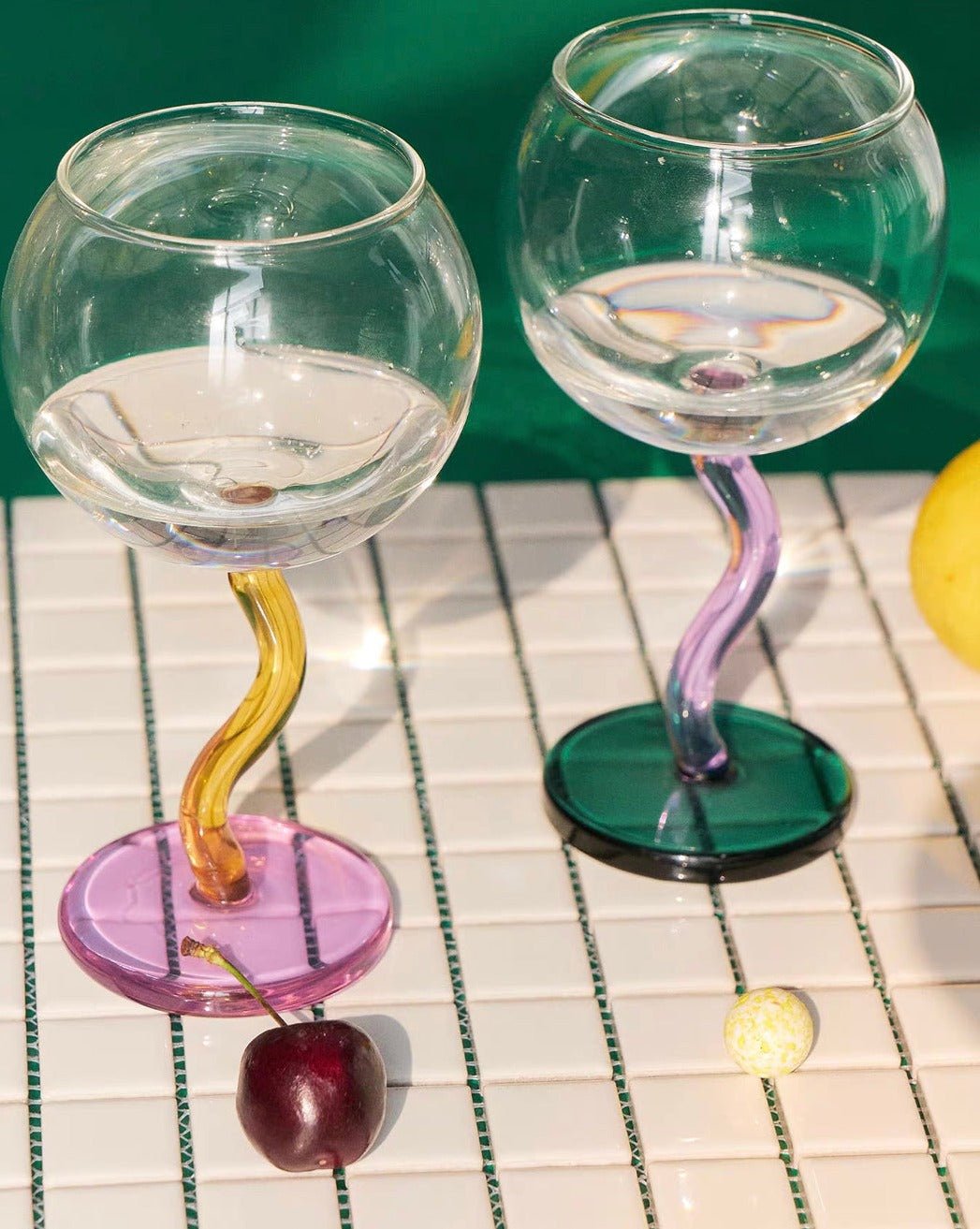 Handblown Bubble Wine Glass featuring a colorful, whimsical design with a wavy stem, perfect for enhancing wine tasting experiences.