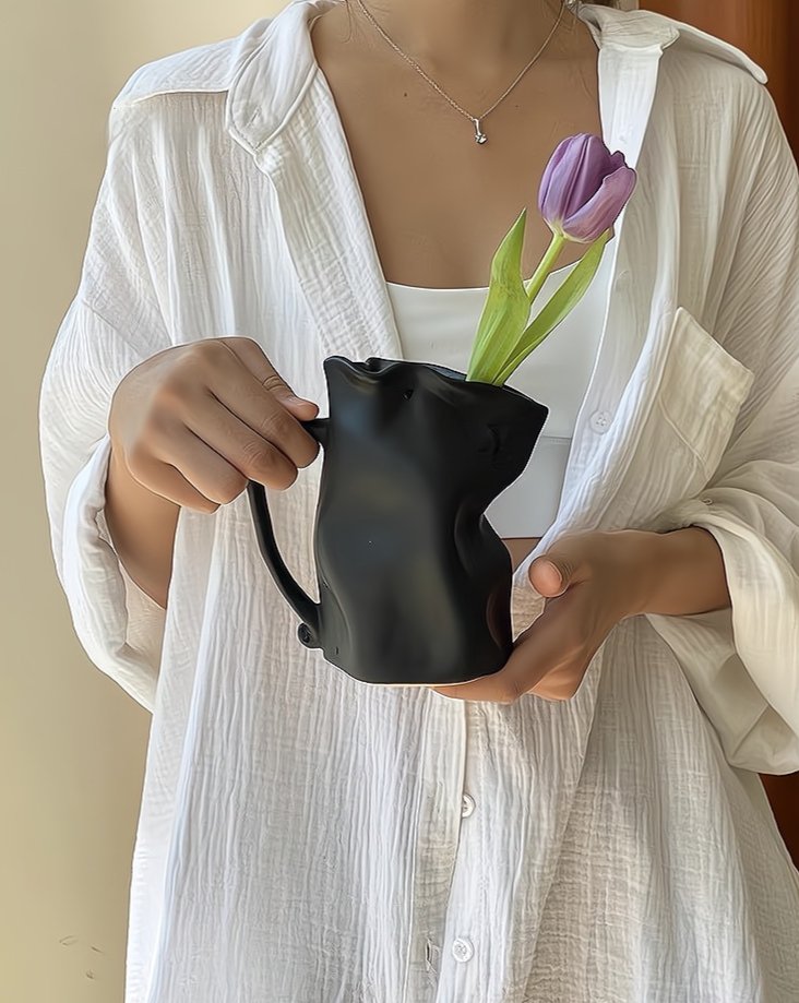 Handcrafted Nordic Style Wrinkle Pottery Jug Vase in black and white, showcasing its unique irregular shape and artisan craftsmanship.