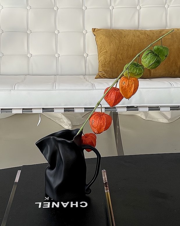 Handcrafted Nordic Style Wrinkle Pottery Jug Vase in black and white, showcasing its unique irregular shape and artisan craftsmanship.