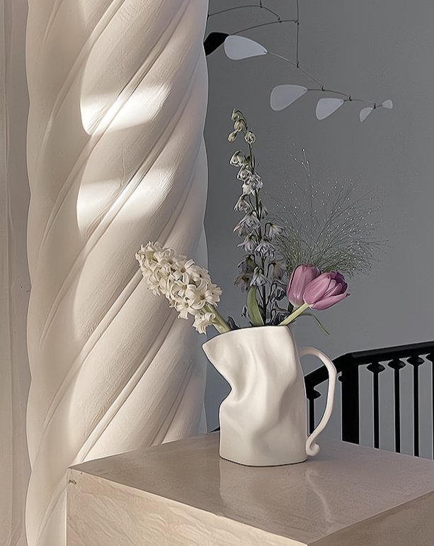 Handcrafted Nordic Style Wrinkle Pottery Jug Vase in black and white, showcasing its unique irregular shape and artisan craftsmanship.