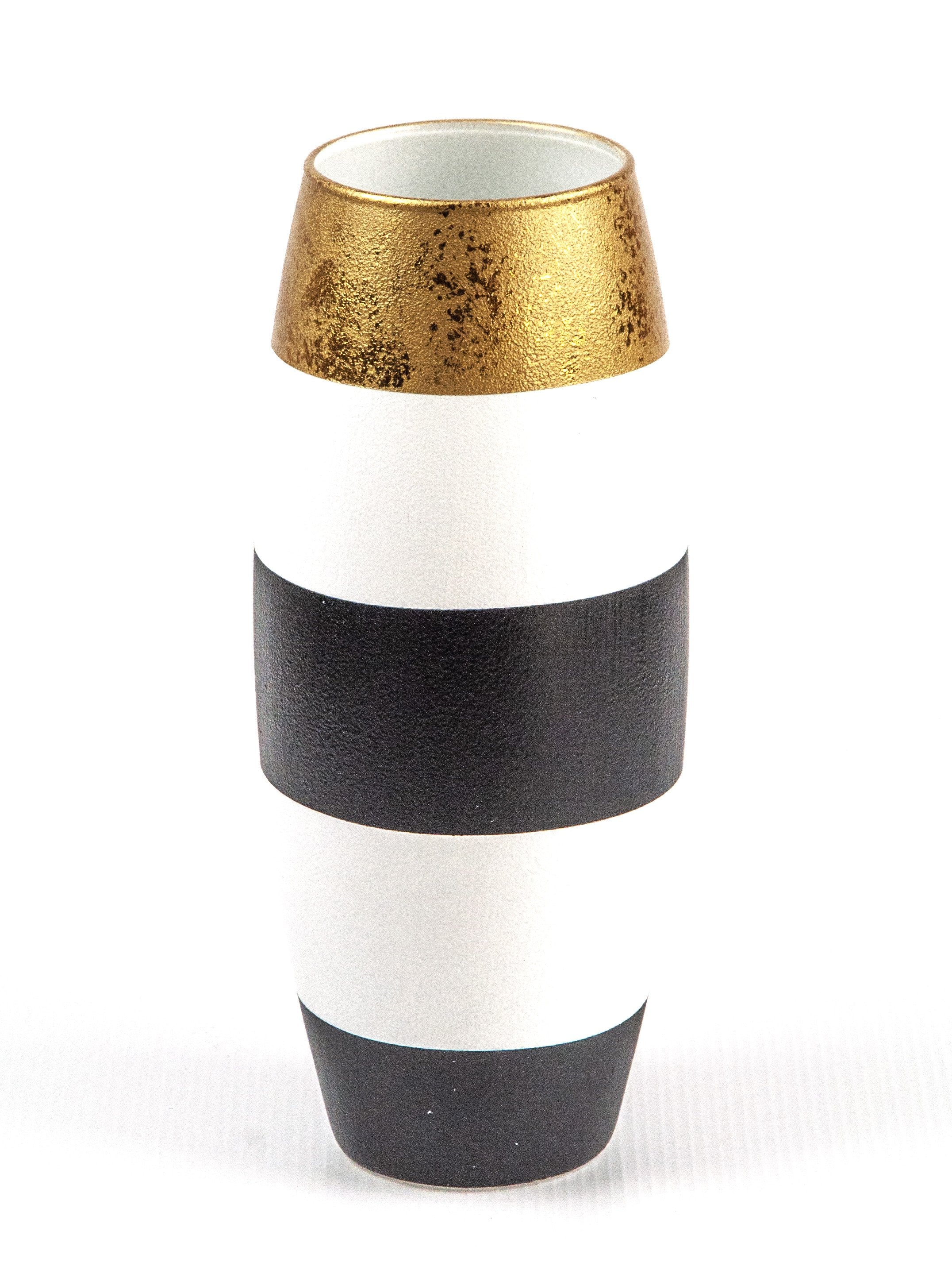 A beautifully hand-painted oval vase made of glass, featuring intricate black and white designs, perfect for floral arrangements.