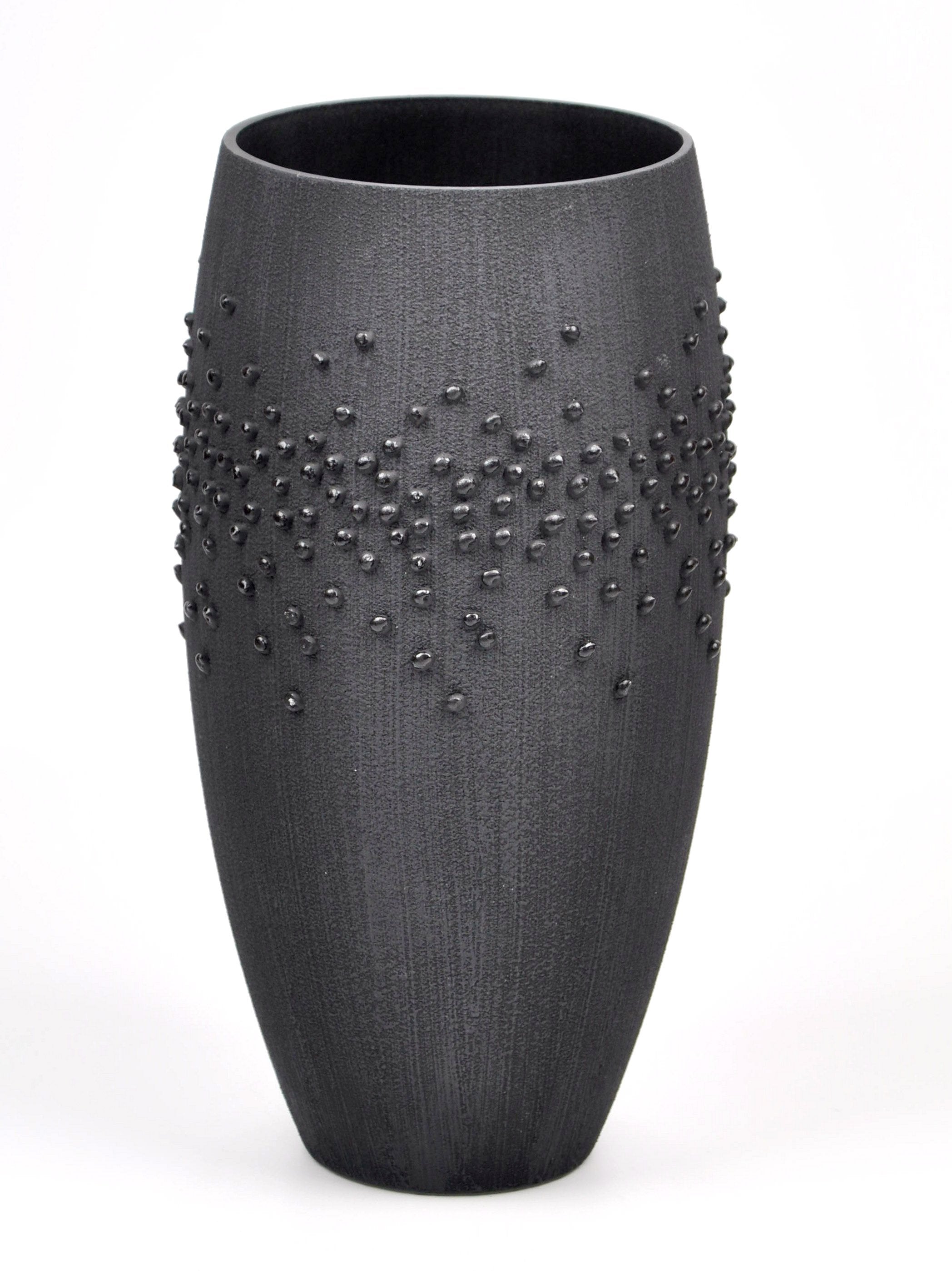 Handpainted black glass vase featuring unique artistic designs, perfect for home decor.